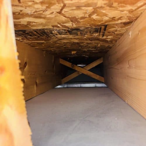 The same air duct clear of dust after cleaning
